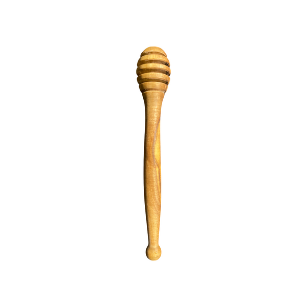 Wooden honey dipper on a white background