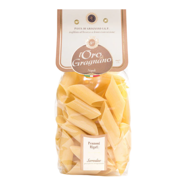 Bag of penne rigate pasta with 'L'Oro Gragnano' label on a white background